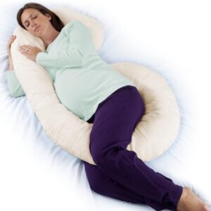 Almohada de cuerpo completo para embarazo y lactancia color blanco, sobre cama con decoración minimalista.