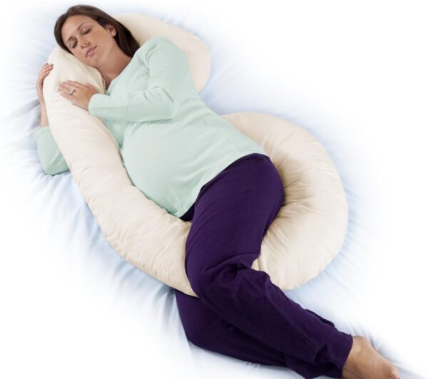 Almohada de cuerpo completo para embarazo y lactancia color blanco, sobre cama con decoración minimalista.