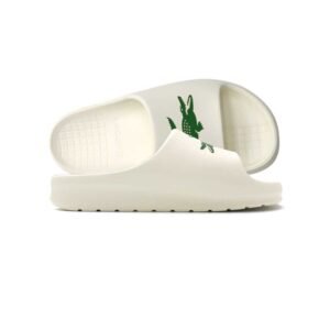 Sandalias Lacoste The Serve Slide 2.0 Off White con tira blanca y doble cocodrilo verde, suela EVA robusta.